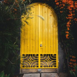 yellow metal door close-up photography